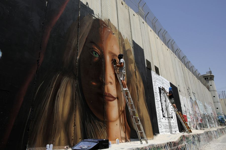 West Bank Graffiti Artists Arrested Over Mural Of Jailed Teen Activist Tamimi