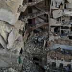 A January 25 aerial view shows a heavily damaged residential building hit during recent air strikes by Russian-backed Syrian forces in the jihadist-held city of Maaret al-Numan, in Syria's northwestern Idlib Province. (Omar Haj Kadour/AFP via Getty Images)