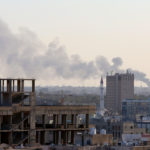 Smoke marks the spot in southern Tripoli where units of Libya’s Ankara-backed Government of National Accord destroyed armed vehicles belonging to the insurgent Libyan National Army on January 29. (Enes Canli/Anadolu Agency via Getty Images)