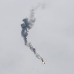 A burning military helicopter belonging to Syrian government forces crashes after being shot in the rebel-held Idlib province, February 11. (Anas Alkharboutli/picture alliance via Getty Images)
