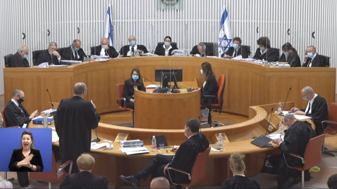 Masked Justice: Israel’s Top Court Weighs Legitimacy of Coming Government (AUDIO INTERVIEW)