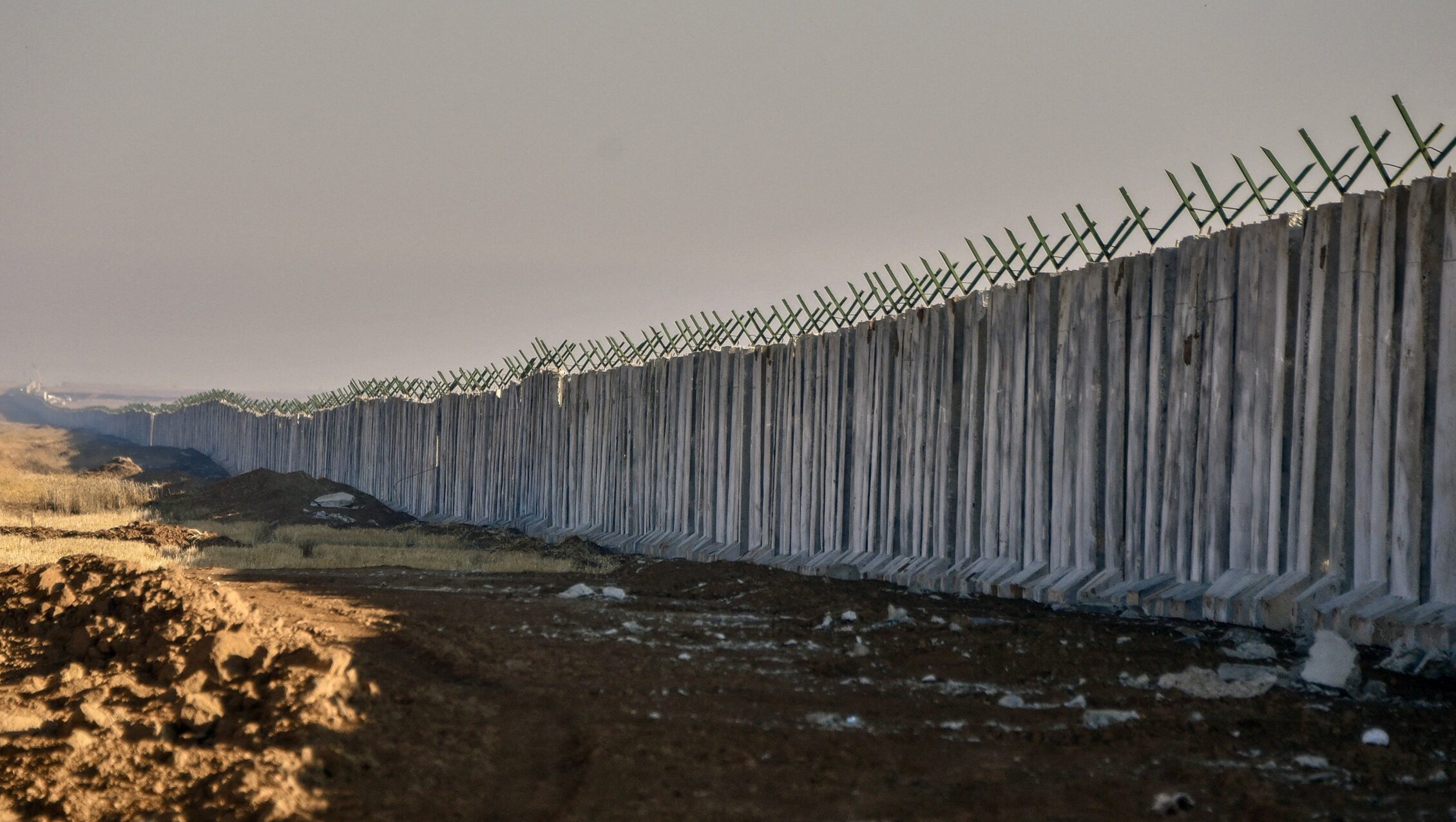 As the Concrete Curtain Rises: Iraq’s New Border Wall Cuts Off Militias, Splits Border Tribes